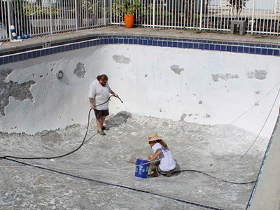 Resurfacing a pool surface preparation